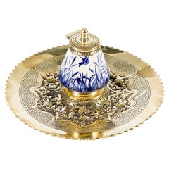 Blue & white ceramic inkwell with circular brass stand