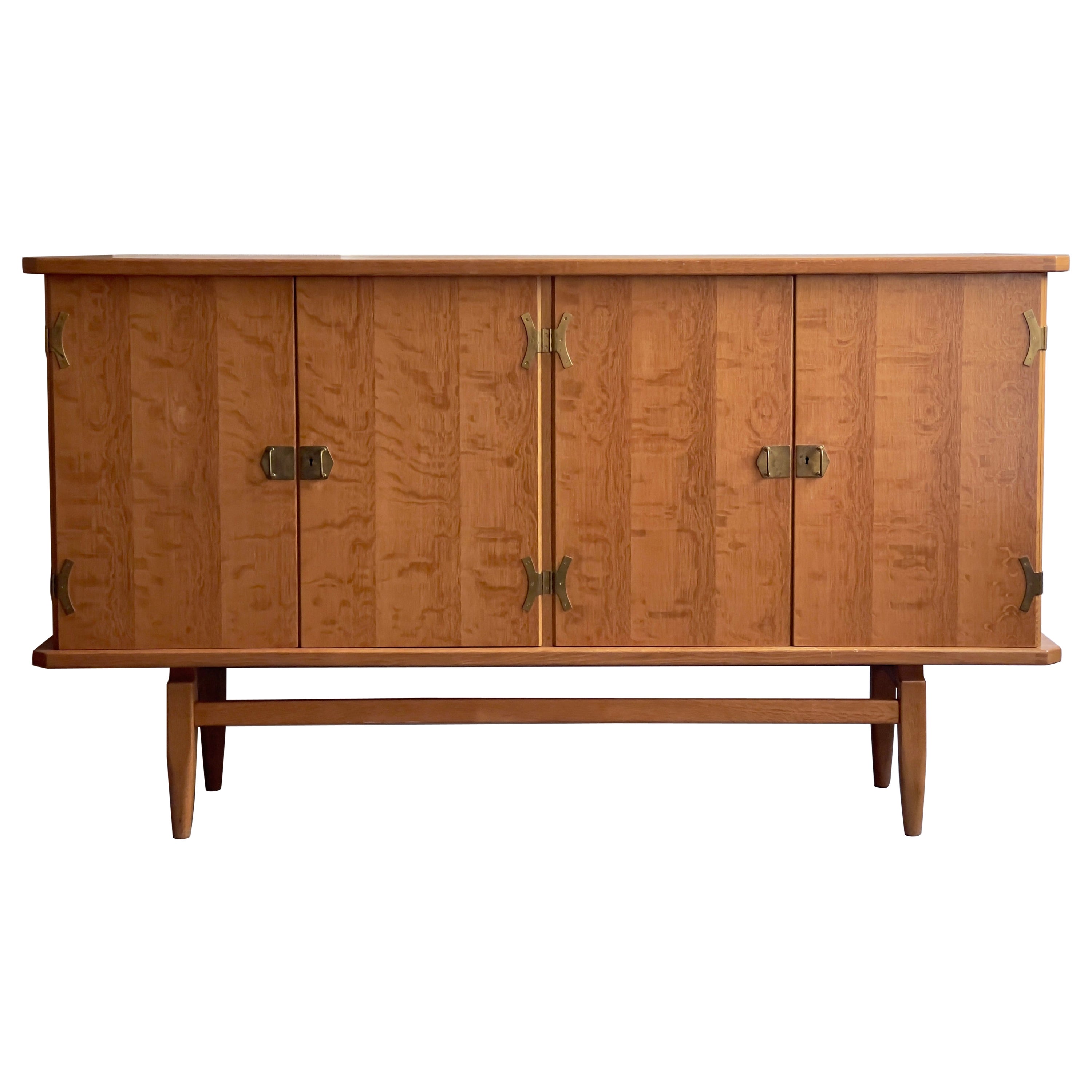 Rare 1970s Danish Sideboard in oak and brass brackets design by Henning Kjærnulf For Sale