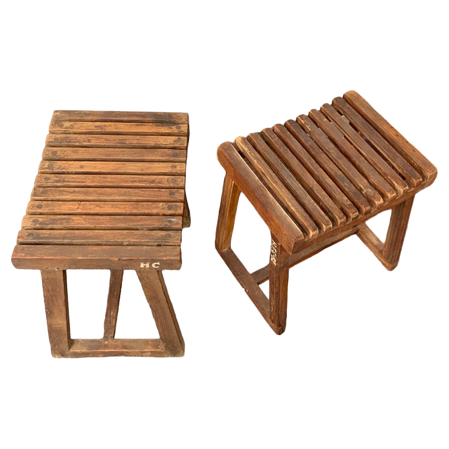 Pair of unrestored low teak stools from Chandigarh India. 

Wood shows signs of age. 

Designed by Pierre Jeanneret. 

Restoration is available upon request. 


