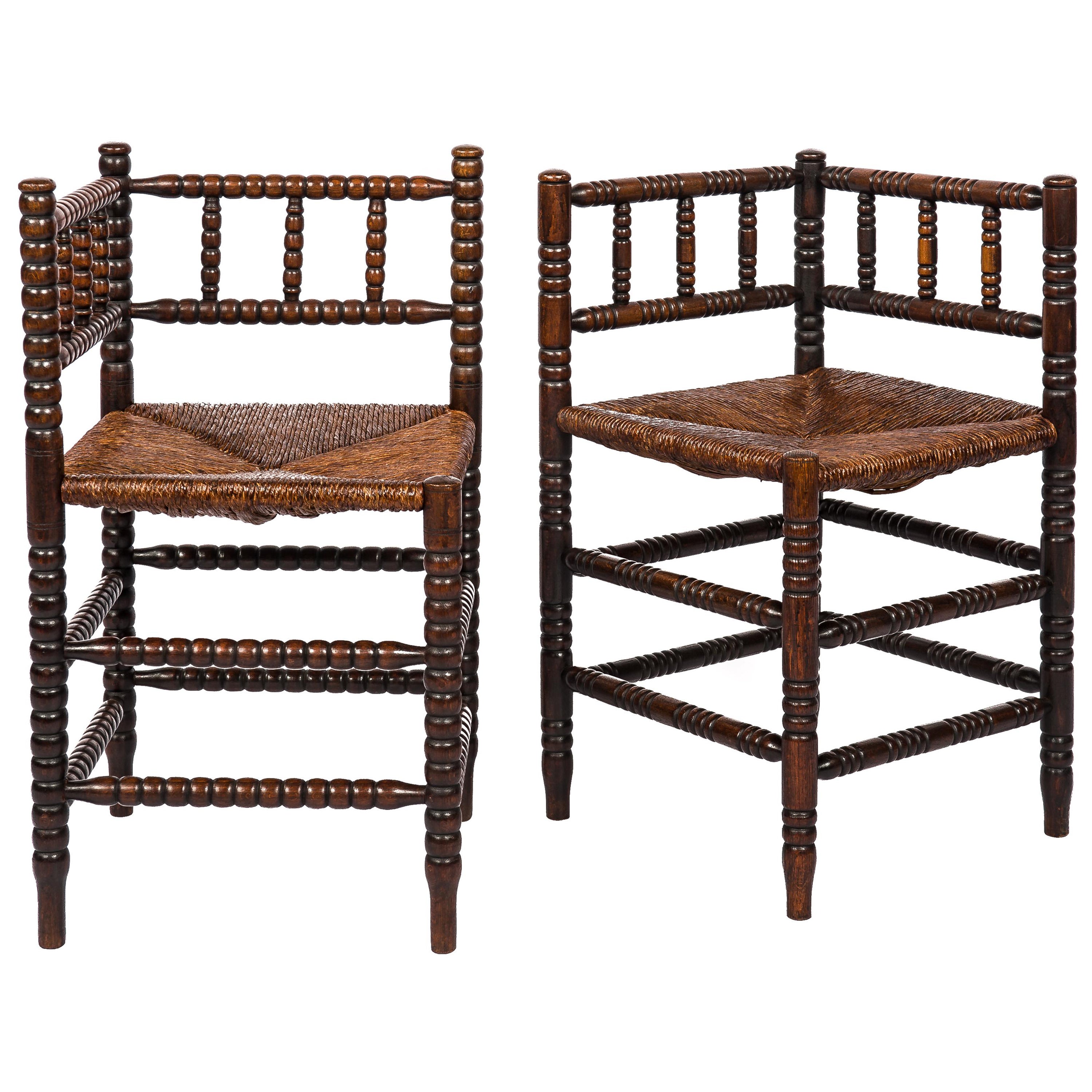 Antique 20th Century Set of two  brown French Arts & Crafts Bobbin Corner Chairs For Sale