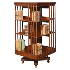 Walnut three tier revolving bookcase