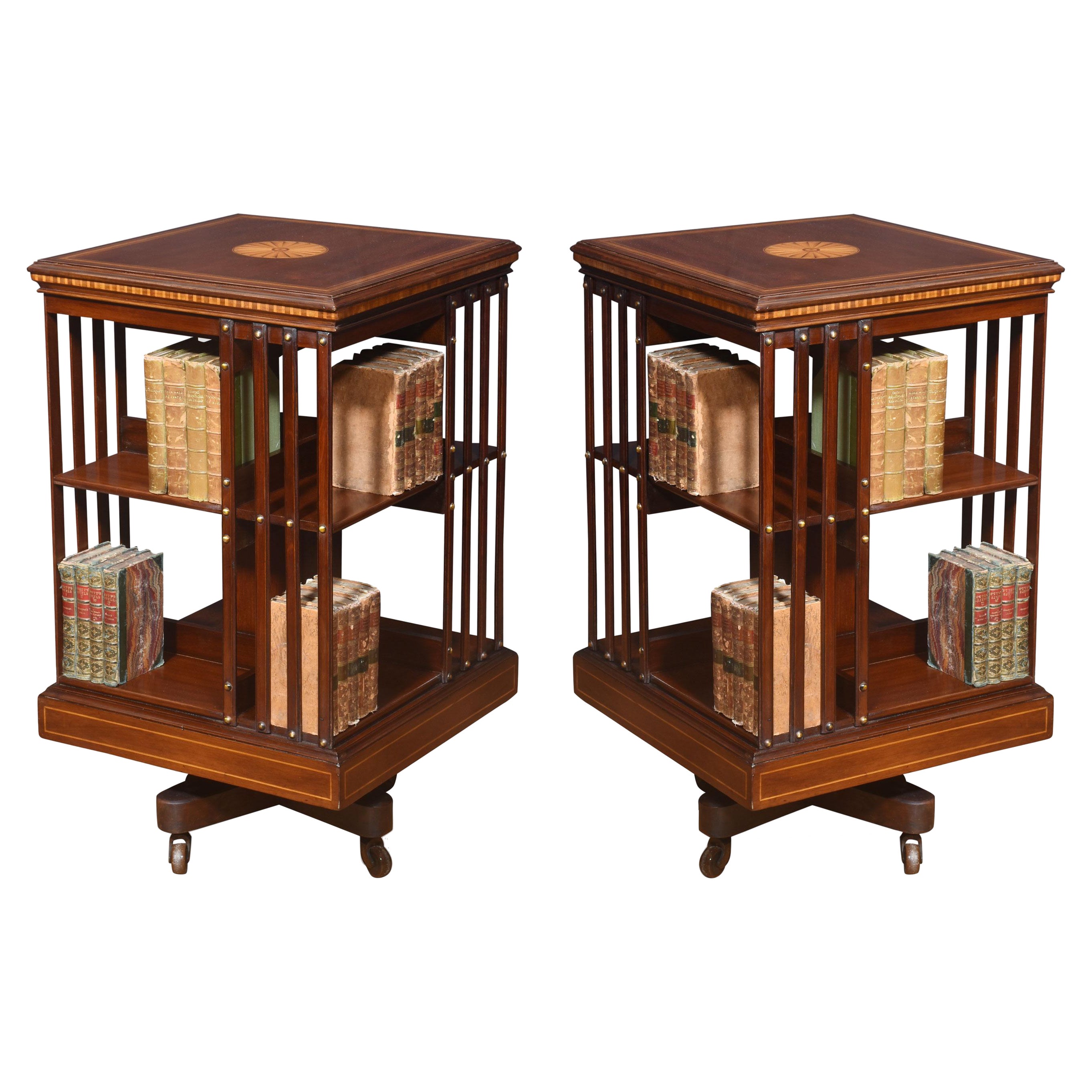 Pair of mahogany inlaid revolving bookcases by Maple and Co For Sale