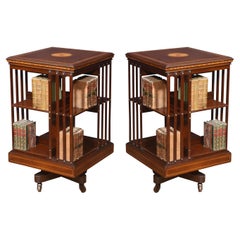 Pair of mahogany inlaid revolving bookcases by Maple and Co