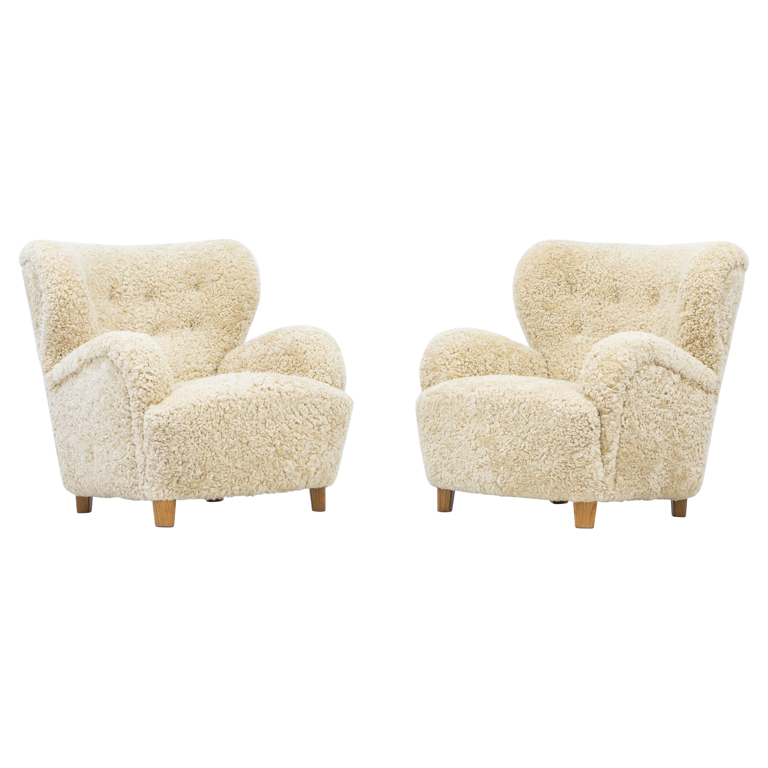 Danish modern sheepskin lounge chairs in the style of Flemming Lassen