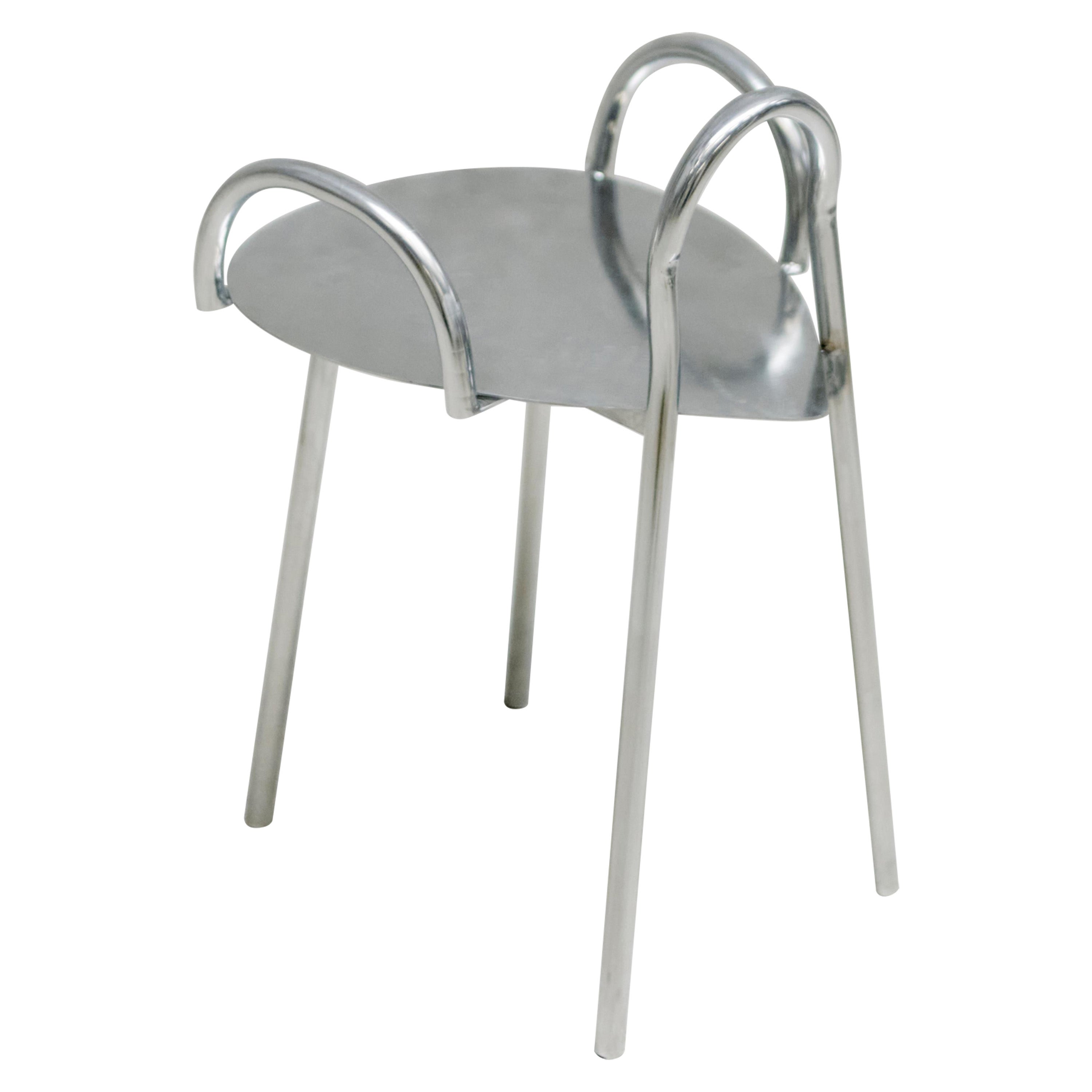 "Tumble" Chair in stainless steel tube and polished seat.