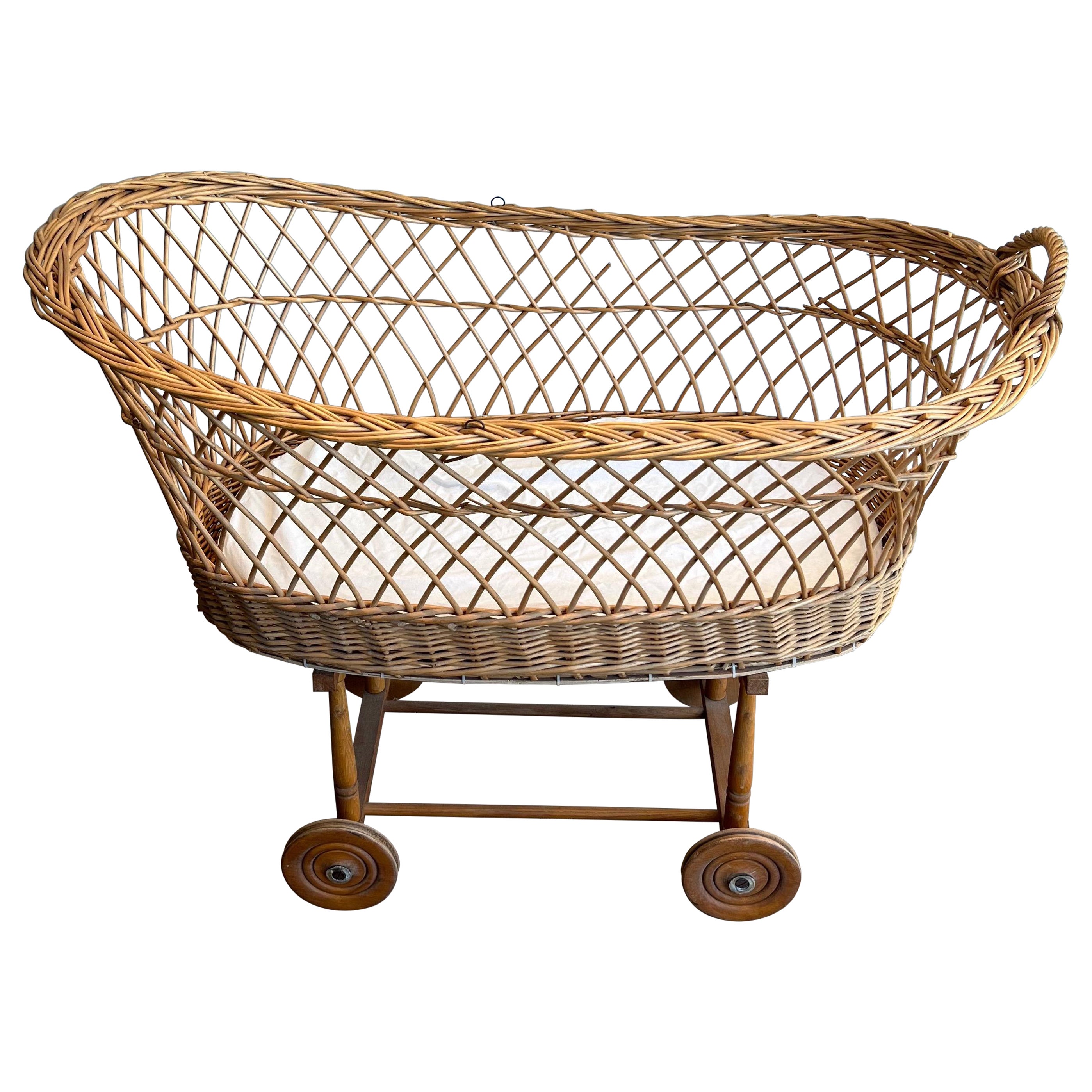 Rattan cradle on casters. French work. Circa 1950 For Sale