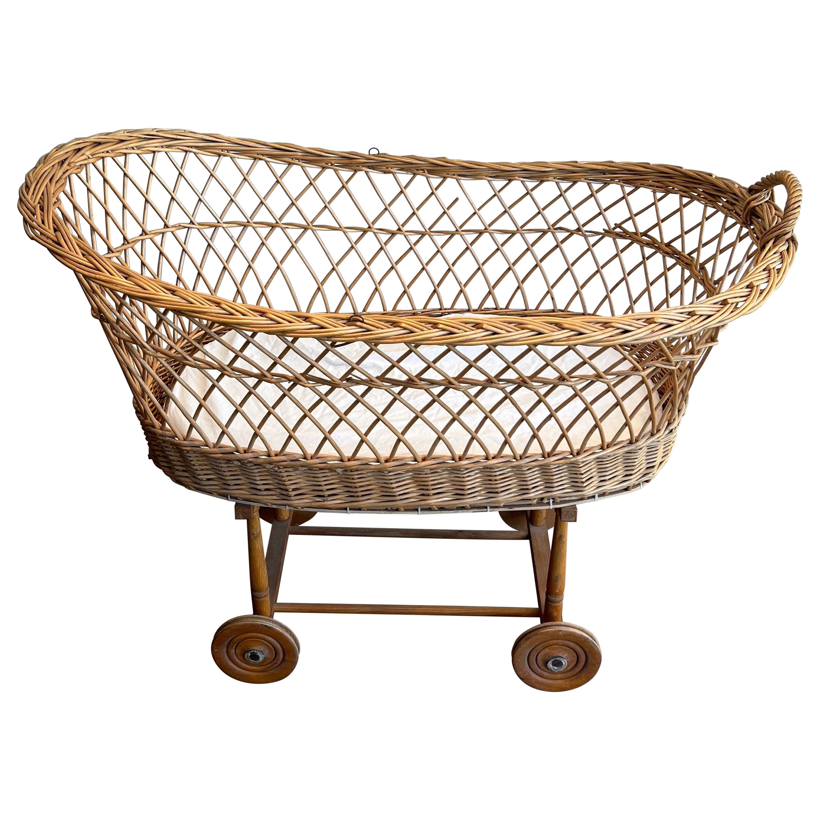 Rattan cradle on casters. French work. Circa 1950