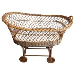 Rattan cradle on casters. French work. Circa 1950