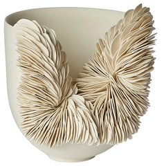 White Collapsed Bowl a porcelain sculptural vessel by Olivia walking frame
