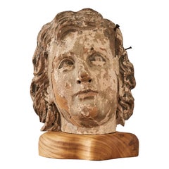 Busto con testa intagliata patinata