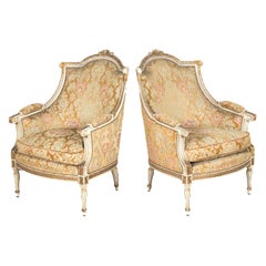 Pair of French Louis XVI Style Parcel Gilt and Painted Maison Jansen Bergeres 