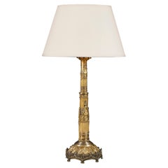A brass gothic column table lamp