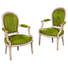 A pair of green velvet Louis XVI fauteuils armchairs 