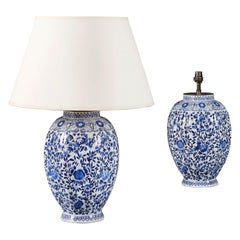 A pair of 19th century blue and white delft lamps 