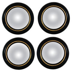 Set of Four Regency Convex Bullseye Mirrors in Black Plaster and Gold Leaf