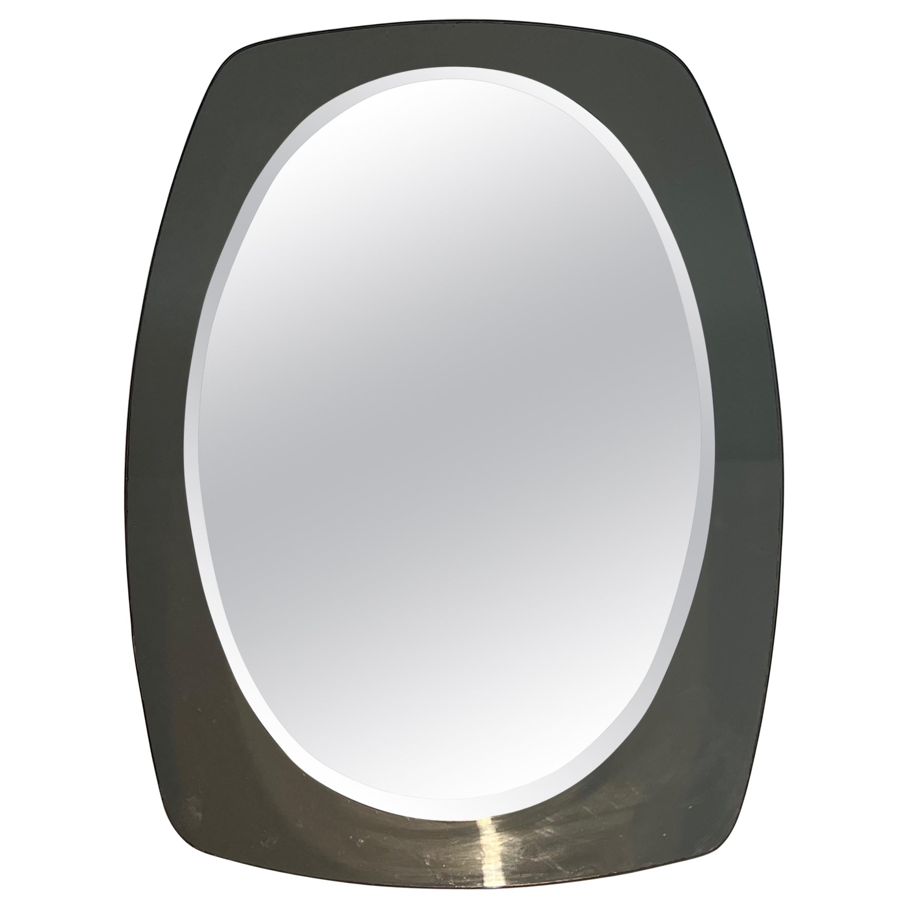 Oval mirror. Italian work by Fontana Arte. Circa 1970 For Sale
