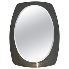 Oval mirror. Italian work by Fontana Arte. Circa 1970