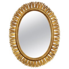 Miroir espagnol ovale doré en forme d'étoile ou de soleil (H 31 1/2 x L 24 1/2)