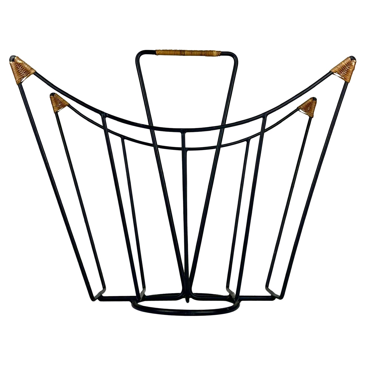 Sculptural 1950s metal magazine rack with twisted rattan details Laurids Lonborg For Sale