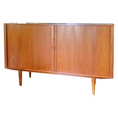 Vintage A MCM minimalist teak tall sideboard with tambour doors and tapered legs