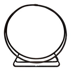 Porte-bûches circulaire sculptural en fer forgé noir des années 1960