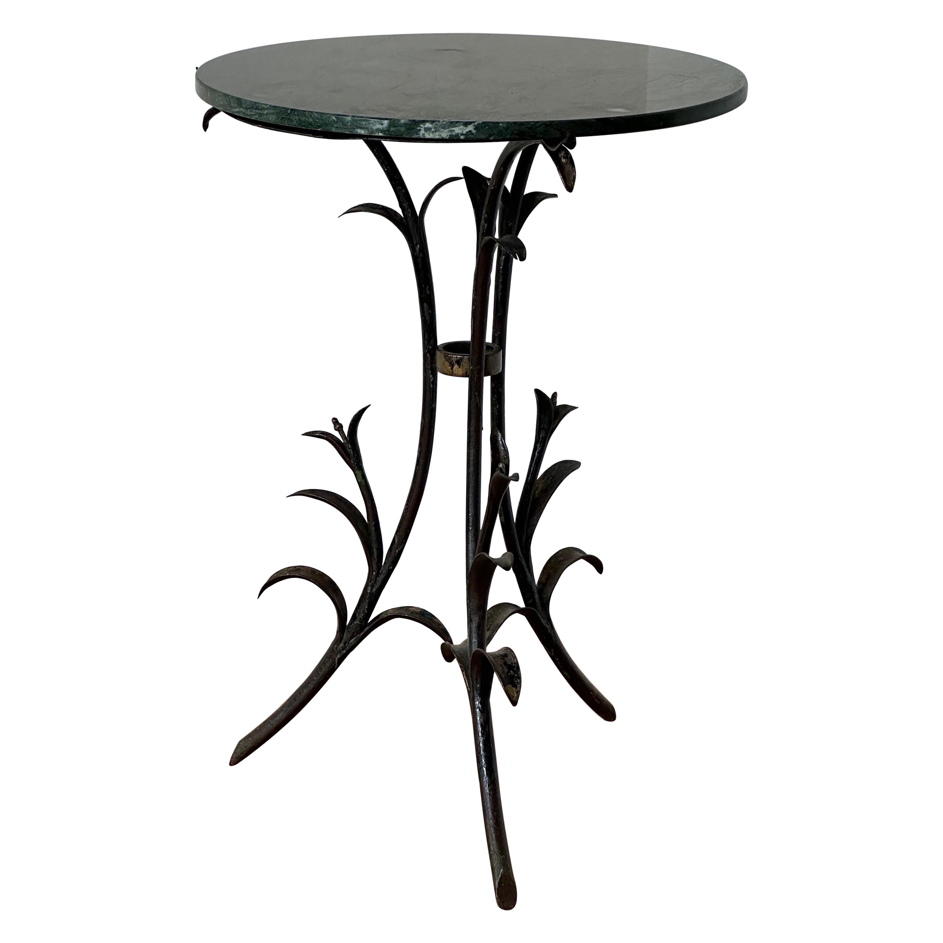 Art deco iron and marble top table with floral decoration  For Sale