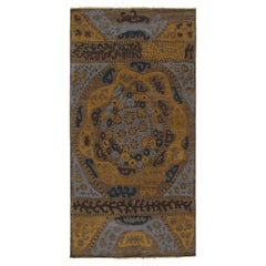 Rug & Kilim’s Tribal Inspired Rug in Blue, Brown, Gold Geometric Patterns