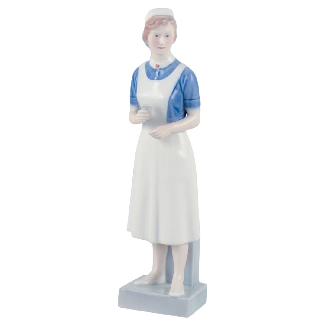 Royal Copenhagen, rare porcelain figurine of a nurse. Model: 4507/156.  For Sale