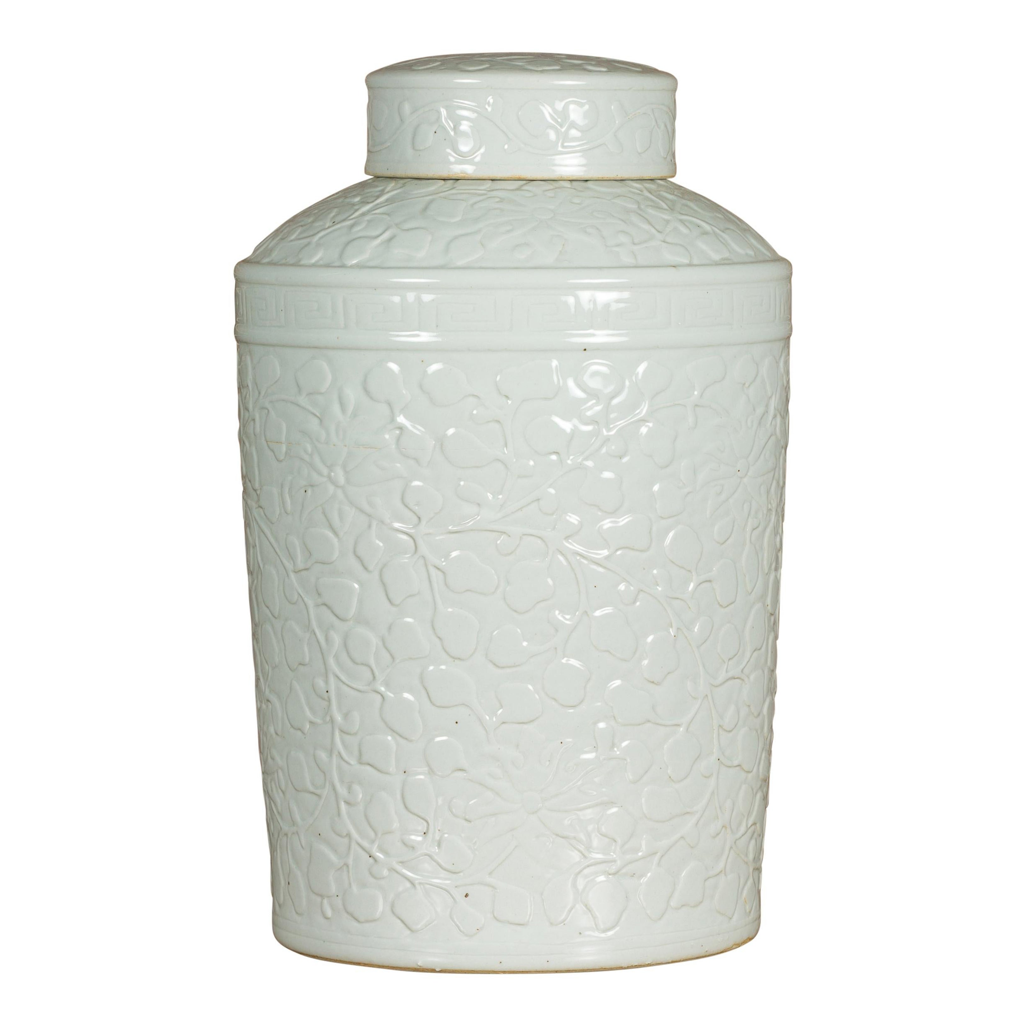 White Porcelain Asian Lidded Jar with Scrolling Foliage Motifs For Sale