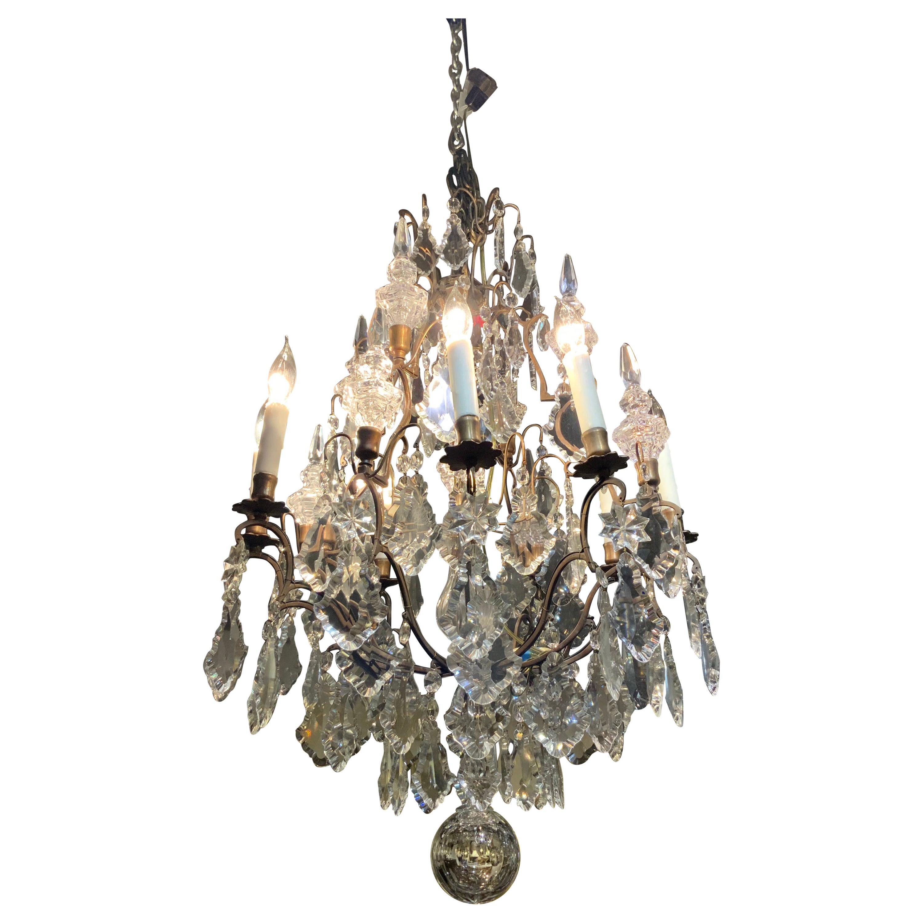 French bronze and crystal eight light chandelier  For Sale