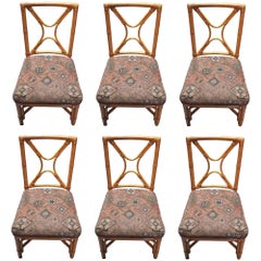 Restored Rattan set of 6 Dining Chairs Featuring X-back and Leather Wrappings.