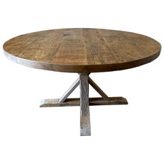 Round walnut pedestal base dining table