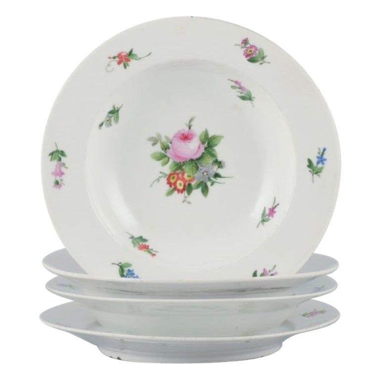 Royal Copenhagen, set of four rare and antique Saxon Flower porcelain plates. For Sale
