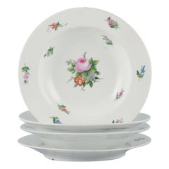 Royal Copenhagen, set of four rare and antique Saxon Flower porcelain plates.