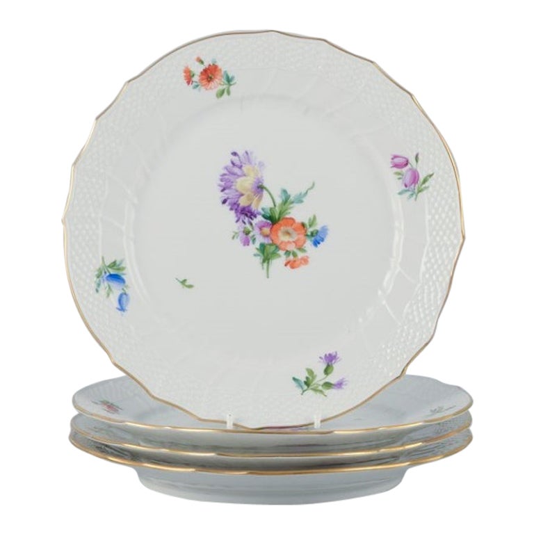 Royal Copenhagen, four Saxon Flower dinner plates in porcelain. For Sale