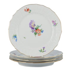 Royal Copenhagen, four Saxon Flower dinner plates in porcelain.