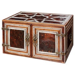 An Indian colonial tortoiseshell veneered teak portable two-door cabinet