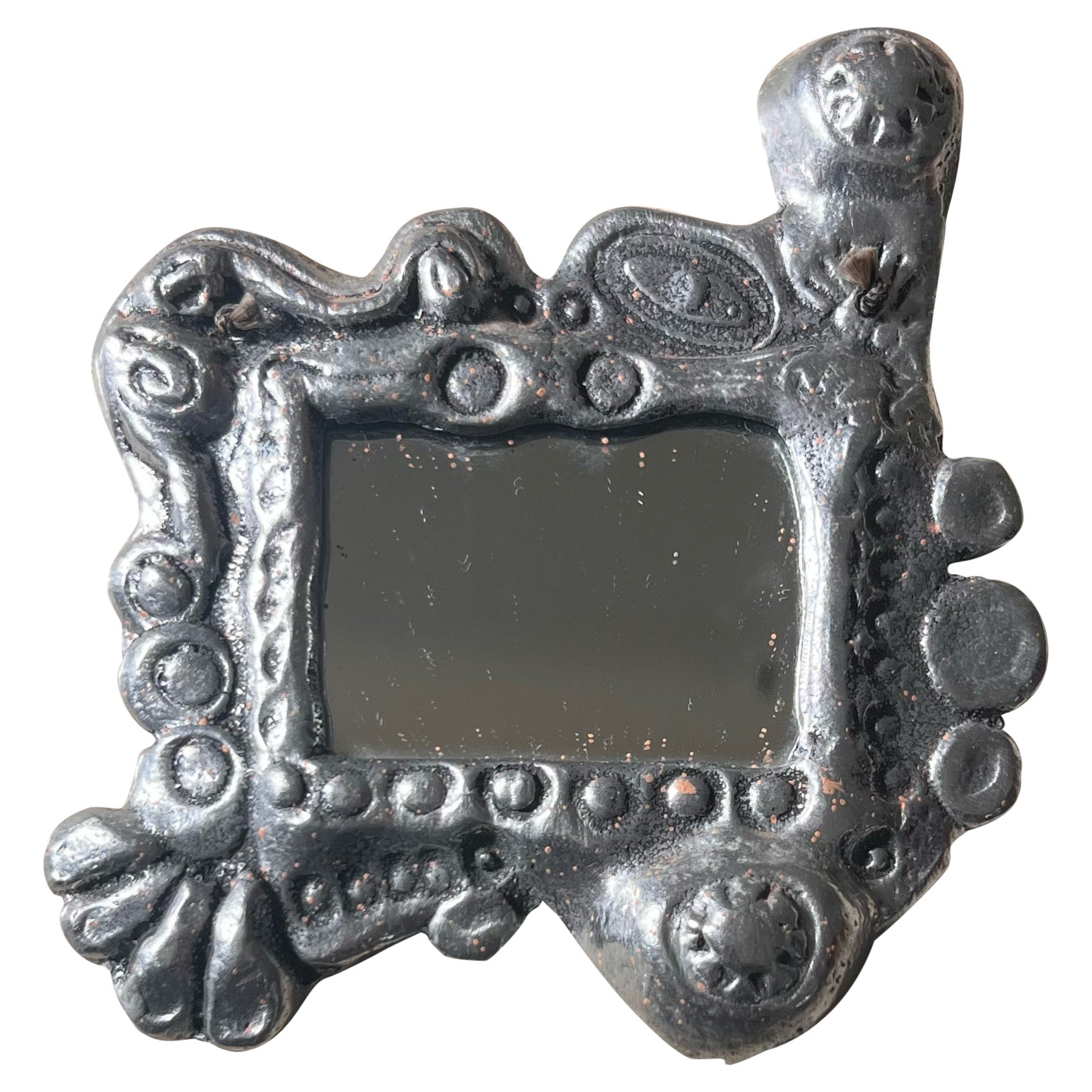 A small brutalist wall mirror by Don Drumm, 1979