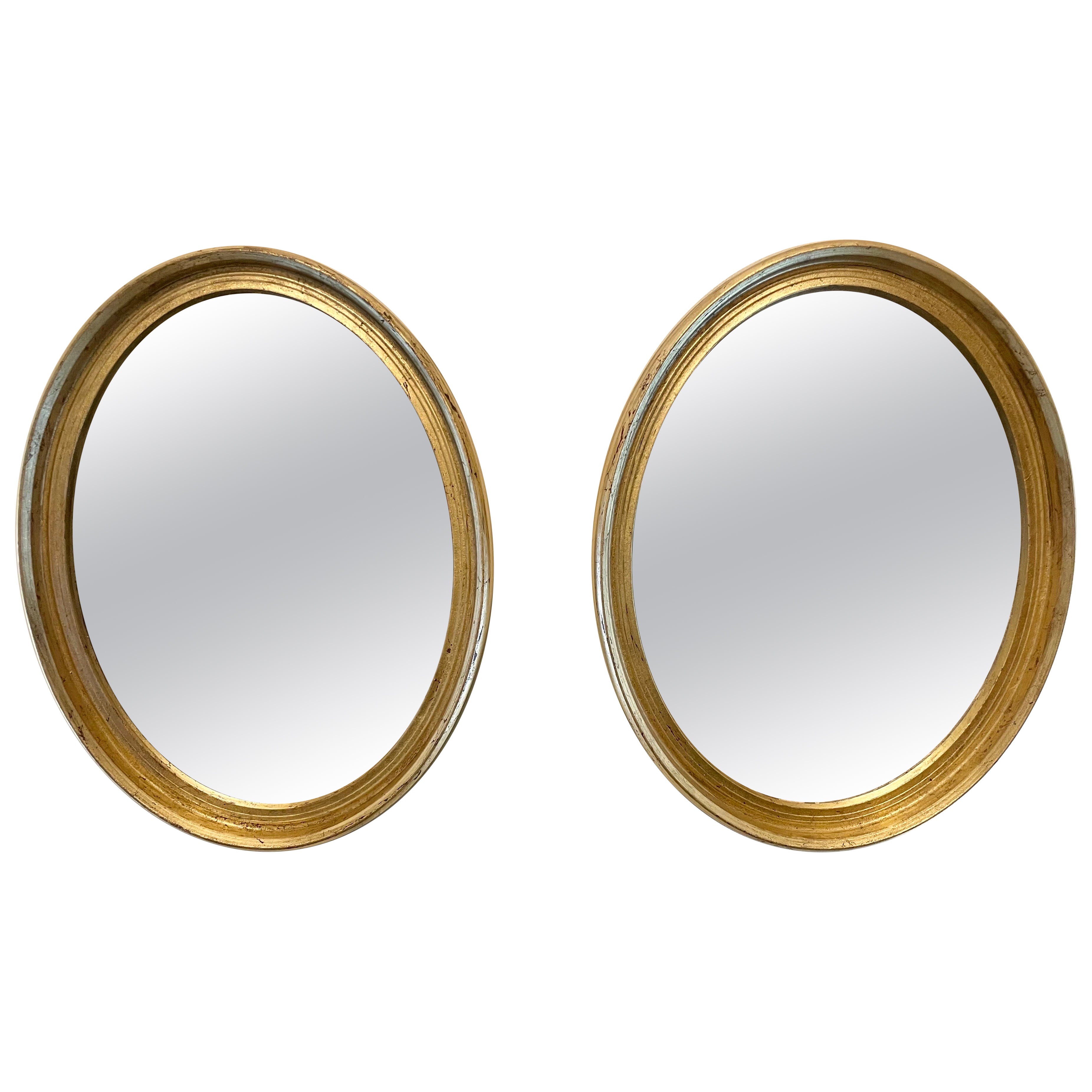 Paire de miroirs italiens ovales dorés vintage