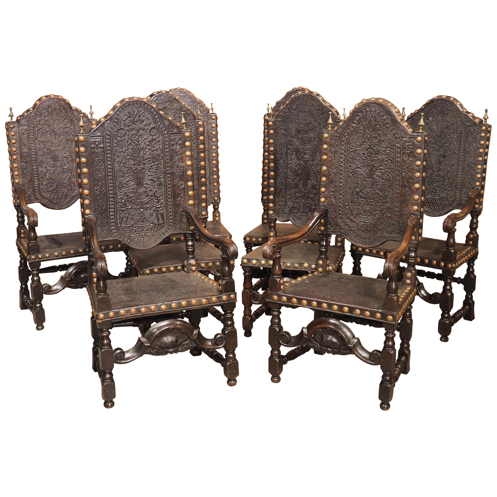 Rare Set of Eight 19th Century Spanish Embossed and Studded Leather Chairs
