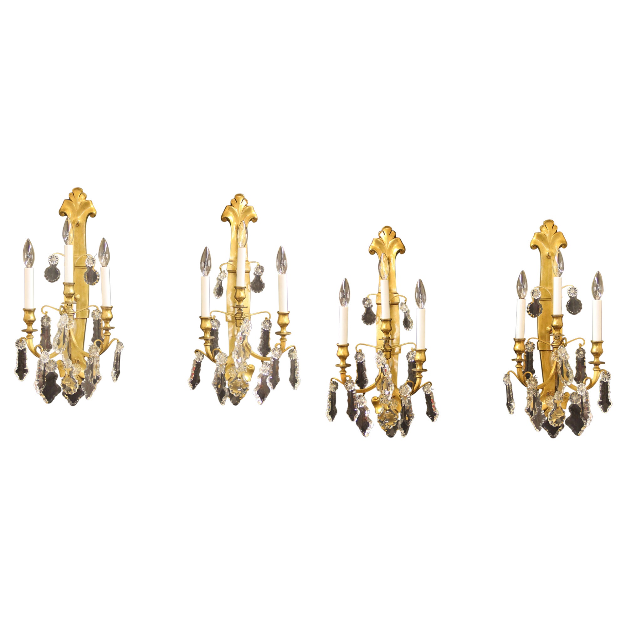 Set of Four Late 19th / Early 20th Century Gilt Bronze and Crystal Sconces
