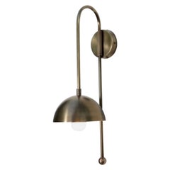A Brass Dome Wall Sconce by Lamp Shaper