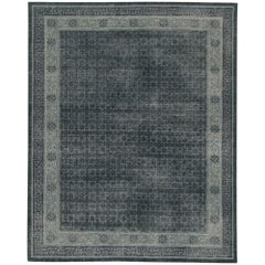 Rug & Kilim’s Distressed Khotan style rug in Blue & Gray Geometric Patterns