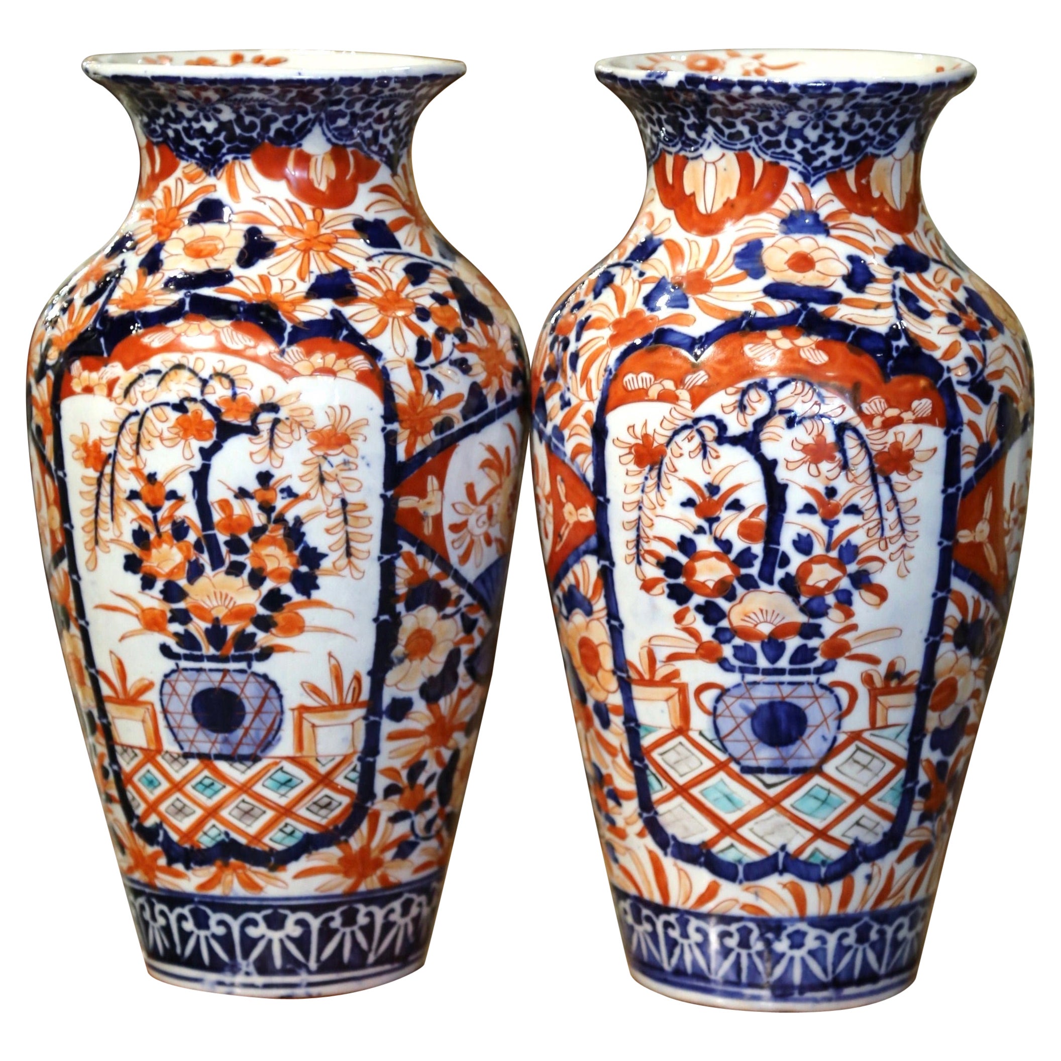 Pair of 19th Century Japanese Porcelain Imari Vases with Floral and Plant Decor For Sale