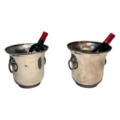 Pair of silver plated champagne buckets ornated on the handles with lion faces. 