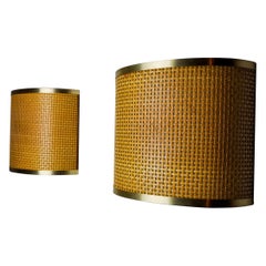 Pair of rattan and brass sconces, Italy, 1960