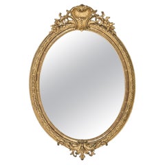 Miroir ovale français ancien du 19ème siècle en bois doré avec crête en coquillage