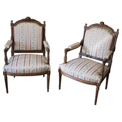 Pair of antique French Henri II walnut armchairs
