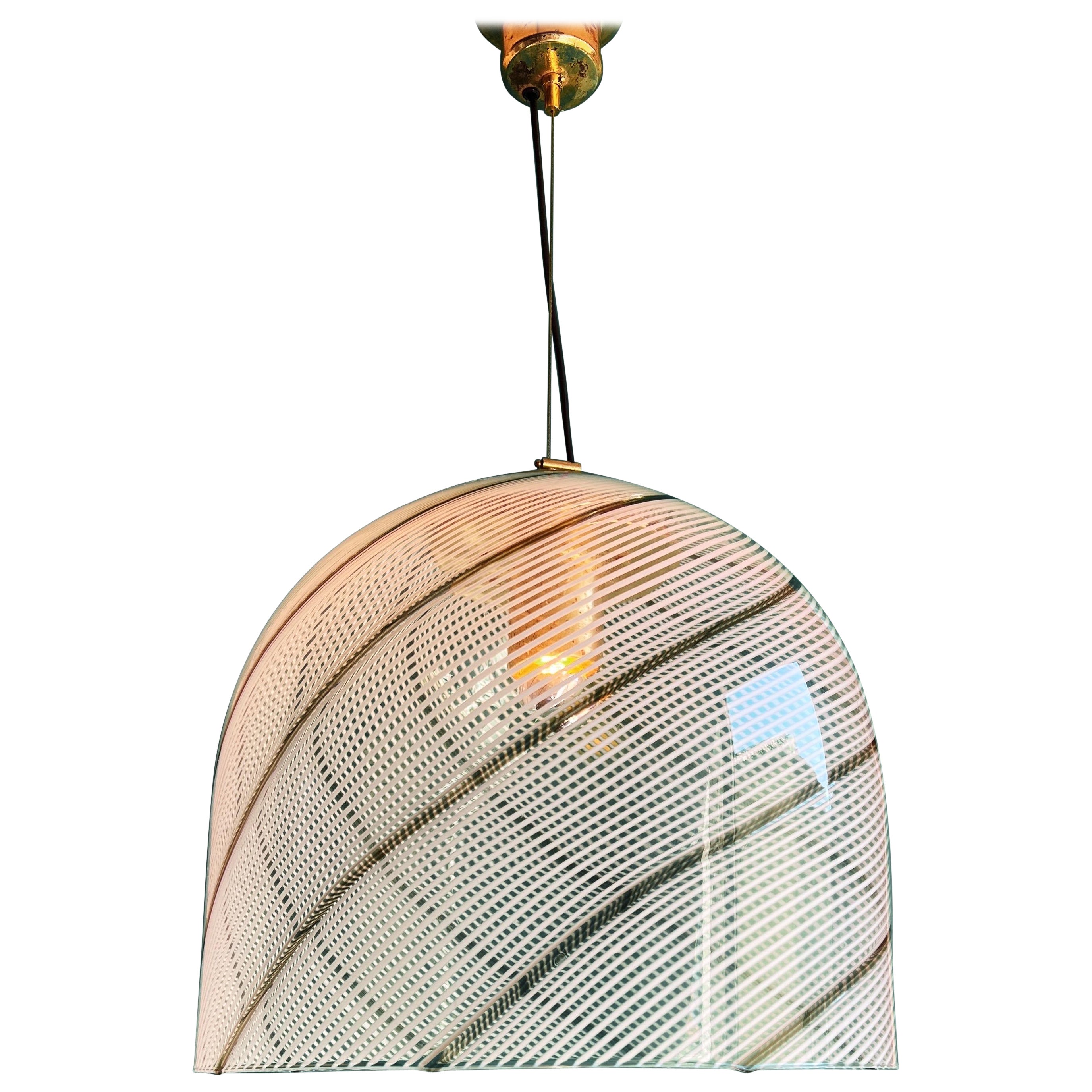 Vintage swirl Murano glass pendant lamp In the style of Venini, circa 1970s.