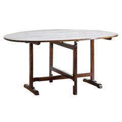 French Neoclassic Figured Walnut Oval Folding Vendange Table, 2ndq 19th century